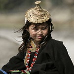 A Layap woman in the conical bamboo hat worn in Laya