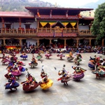 A masked cham dancer mid-turn