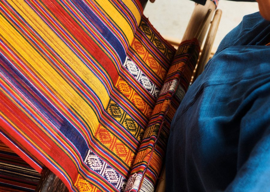 Process of weaving kira (national dress for women).