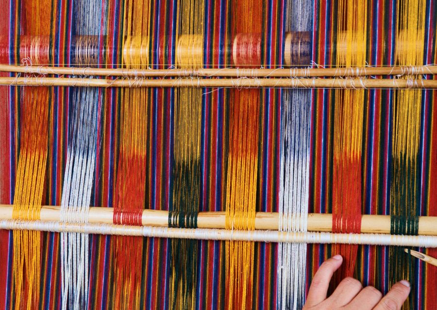 Process of weaving kira (national dress for women).